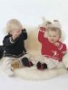 Plain knit sweater with sewn-on figure
