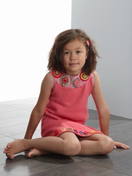 Knitted dress with crochet flowers